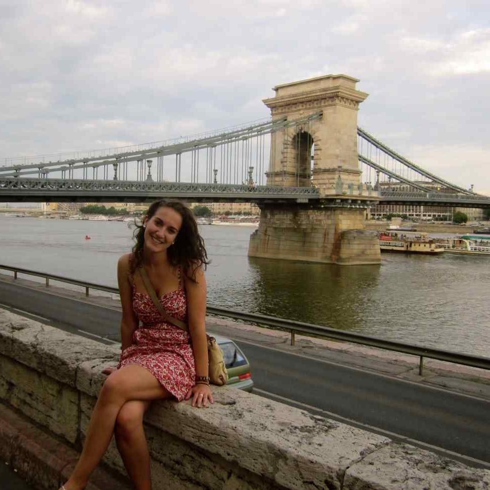 Student sitting on bridge in Czech Republic